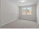 Bedroom with a large window that provides lots of natural light at 317 Highland Ridge Ln, Knightdale, NC 27545