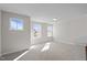 An upstairs room with lots of windows providing natural light at 317 Highland Ridge Ln, Knightdale, NC 27545