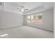 Spacious bedroom with tray ceiling, fan and large windows at 317 Highland Ridge Ln, Knightdale, NC 27545
