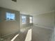 Spacious bedroom with three windows and sunlight at 317 Highland Ridge Ln, Knightdale, NC 27545