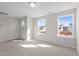 Bedroom with two large windows providing plenty of natural light at 317 Highland Ridge Ln, Knightdale, NC 27545