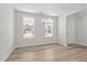 Bright dining room with wood floors, natural light, and a modern chandelier at 317 Highland Ridge Ln, Knightdale, NC 27545