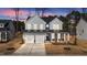 Beautiful two-story home with gray siding, a front porch, and a two-car garage at 317 Highland Ridge Ln, Knightdale, NC 27545