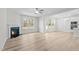 Spacious living room with a fireplace, large windows, and hardwood floors at 317 Highland Ridge Ln, Knightdale, NC 27545