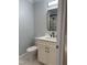 Updated bathroom featuring a modern vanity, sleek fixtures, and a stylish mirror at 352 Faucette Mill Rd, Hillsborough, NC 27278