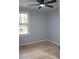This serene bedroom has natural light and backyard views from the large window at 352 Faucette Mill Rd, Hillsborough, NC 27278