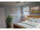 Bedroom virtually staged with a queen bed and closet, offers natural light and a calming atmosphere at 352 Faucette Mill Rd, Hillsborough, NC 27278