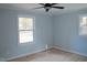 Bright bedroom with wood floors, two windows and neutral paint, perfect for relaxation at 352 Faucette Mill Rd, Hillsborough, NC 27278