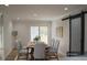 Bright dining room featuring a wooden table, six chairs and sliding door to the backyard deck at 352 Faucette Mill Rd, Hillsborough, NC 27278