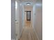 Hallway with natural light and doors leading to various rooms in the home at 352 Faucette Mill Rd, Hillsborough, NC 27278