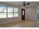 Inviting living room with lots of natural light, hardwood floors, and a fan at 352 Faucette Mill Rd, Hillsborough, NC 27278
