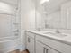 Bright bathroom featuring double vanity, quartz counters, and shower-tub combo at 53 Lavender Ln, Clayton, NC 27520