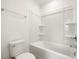 Bright and clean bathroom featuring a tub shower with a standard toilet at 53 Lavender Ln, Clayton, NC 27520