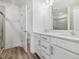 Bathroom with double vanity, modern fixtures, walk-in shower, and toilet behind the door at 53 Lavender Ln, Clayton, NC 27520