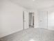 Bedroom featuring neutral carpeting, white walls, and access to bathroom and closet at 53 Lavender Ln, Clayton, NC 27520