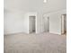 This spacious bedroom features neutral carpeting, white walls, and multiple closets for ample storage at 53 Lavender Ln, Clayton, NC 27520