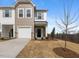Charming townhome with a one-car garage, neutral siding, and a well-maintained front yard at 53 Lavender Ln, Clayton, NC 27520