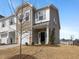 New townhome featuring varied siding, a well-manicured lawn, and a one car garage at 53 Lavender Ln, Clayton, NC 27520