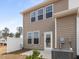 Rear exterior view with AC, glass door, and privacy fence at 53 Lavender Ln, Clayton, NC 27520