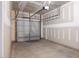 Empty two-car garage featuring a concrete floor and a garage door with an opener at 53 Lavender Ln, Clayton, NC 27520
