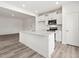 Bright kitchen featuring white cabinets, stainless appliances, and an island with a sink at 53 Lavender Ln, Clayton, NC 27520