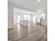 Bright, open living space featuring hardwood floors, an island, and stairway access at 53 Lavender Ln, Clayton, NC 27520
