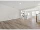Open concept living area with modern wood-look flooring and plenty of natural light at 53 Lavender Ln, Clayton, NC 27520