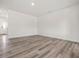 Spacious, light-filled living area with wood-look floors, ready for personalization at 53 Lavender Ln, Clayton, NC 27520
