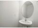 Clean powder room features a pedestal sink, large oval mirror, and minimalist design at 53 Lavender Ln, Clayton, NC 27520