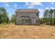 View of the home's backyard showing the home's vinyl siding and the yard at 60 Bennett Rd, Coats, NC 27521