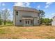 View of the home's backyard showing the home's vinyl siding and the yard at 60 Bennett Rd, Coats, NC 27521