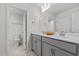 Bright bathroom with double vanity, toilet and access to a shower at 60 Bennett Rd, Coats, NC 27521