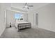 Bedroom with neutral tones, a ceiling fan, and a view through the window at 60 Bennett Rd, Coats, NC 27521