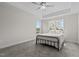 A spacious bedroom with a ceiling fan and natural light from large windows at 60 Bennett Rd, Coats, NC 27521