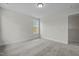 Well lit bedroom, featuring a window, carpeted floors, and neutral color palette at 60 Bennett Rd, Coats, NC 27521