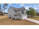 Beautiful two-story home featuring a two-car garage and manicured lawn at 60 Bennett Rd, Coats, NC 27521
