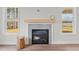 Modern fireplace design with light wood mantle and grey tile at 60 Bennett Rd, Coats, NC 27521