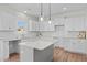 Modern kitchen features granite countertops, subway tile backsplash, and a stylish island with pendant lighting at 60 Bennett Rd, Coats, NC 27521