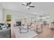 Spacious living room featuring a fireplace, natural light, and open access to the modern kitchen at 60 Bennett Rd, Coats, NC 27521