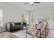 Bright living room featuring a fireplace and hardwood floors at 60 Bennett Rd, Coats, NC 27521