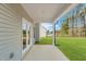 This covered patio provides a lovely view of the expansive backyard at 60 Bennett Rd, Coats, NC 27521