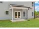 A covered patio, with views of the yard and the side of the home at 60 Bennett Rd, Coats, NC 27521