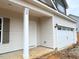 Detailed view of the home's entrance, front door, and the attached two-car garage at 78 Bennett Rd, Coats, NC 27521