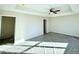 Main bedroom with ceiling fan, walk-in closet, and carpet at 78 Bennett Rd, Coats, NC 27521