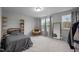 Cozy bedroom features neutral colors, a comfortable bed, and plenty of natural light for a relaxing space at 1725 Langlais Dr, Graham, NC 27253