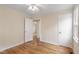 A bright bedroom with hardwood floors and two closets at 320 Zollicoffer Ave, Henderson, NC 27536