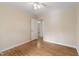 Bedroom with neutral walls, ceiling fan, and hardwood floors, providing a comfortable and inviting atmosphere at 320 Zollicoffer Ave, Henderson, NC 27536