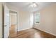 Bedroom with ceiling fan, hardwood floors, closet, and neutral walls, creating a relaxing and functional living space at 320 Zollicoffer Ave, Henderson, NC 27536