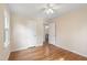 Bedroom with ceiling fan, hardwood floors, and a window, offering a cozy space with natural light and ventilation at 320 Zollicoffer Ave, Henderson, NC 27536