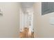 Hallway with neutral paint connecting various rooms, providing easy access to different parts of the home at 320 Zollicoffer Ave, Henderson, NC 27536